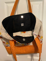 Cream with orange, sky blue floral and orange polka dot base